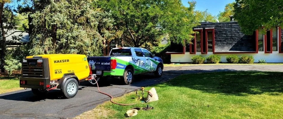 Service vehicles parked near residential property in Denver, CO.