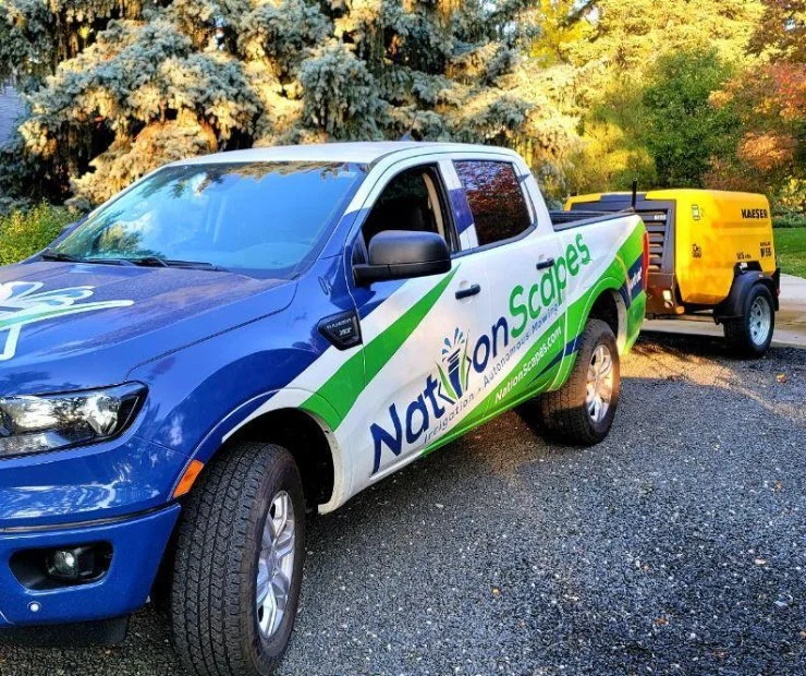 Company vehicle with sprinkler compressor in Denver, CO.