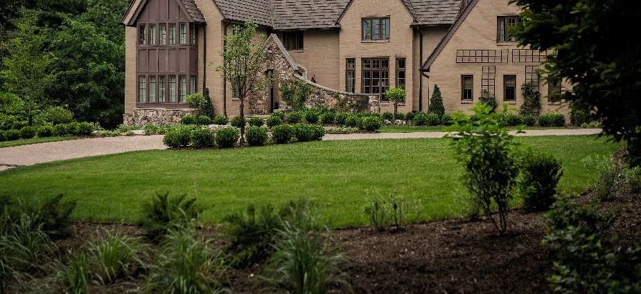 Mulch bed and landscape in front of brown house in Denver, CO.